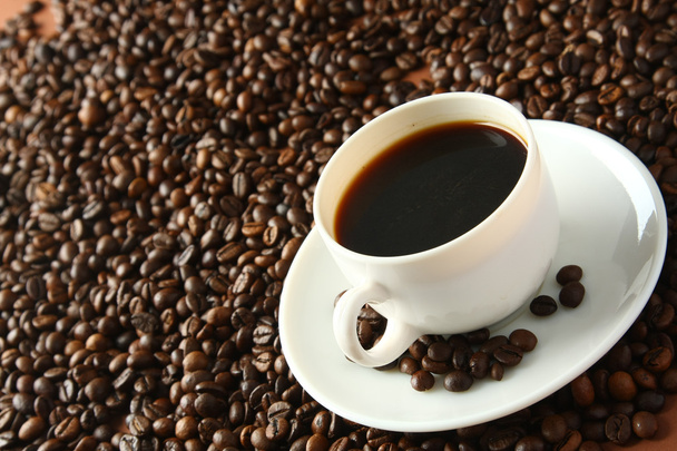 Cup of coffee on coffee beans - Foto, imagen