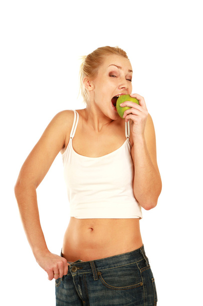 Woman eating green apple - Fotó, kép