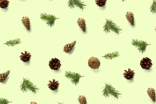 Creative Pine cone Christmas background on green. Pine branches and cones. minimal creative cone arrangement pattern. flat lay, top view. new year background wallpaper. Nature pinecone modern christmas Background - Photo, Image