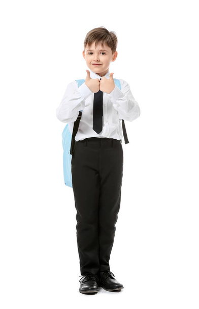 Little schoolboy showing thumb-up on white background - Foto, Imagem