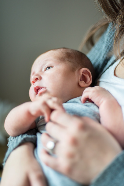 Cute newborn baby serie on grey - Valokuva, kuva