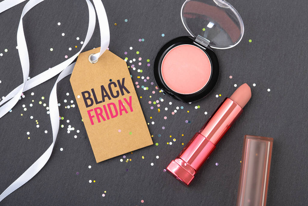 Black Friday beauty and makeup sale concept on dark stone background - Фото, изображение