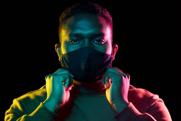 african american man wearing black reusable mask - Fotografie, Obrázek