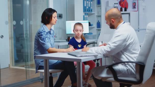 Pediatrician writing prescription - Footage, Video