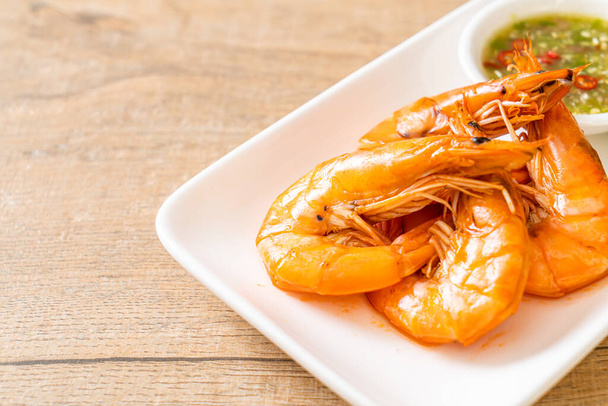 baked salted shrimps or prawns with seafood spicy sauce - seafood style - Photo, Image
