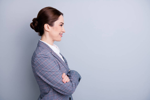 Profile photo of attractive confident business lady arms crossed good mood experienced teacher occupation look empty space wear plaid suit jacket white shirt isolated grey color background - Zdjęcie, obraz