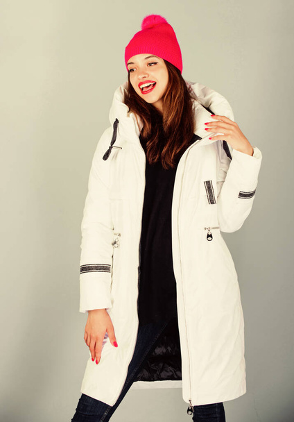 Christmas atmosphere around. woman in padded warm coat. beauty in winter clothing. cold season shopping. happy winter holidays. girl in beanie hat. faux fur fashion. flu and cold. seasonal fashion - Foto, imagen
