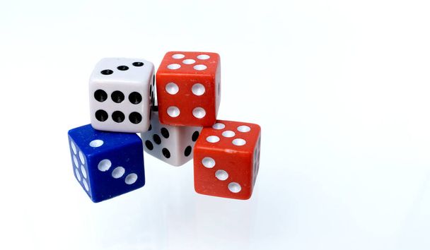 Red, white and blue colored dice isolated on white background - Photo, Image