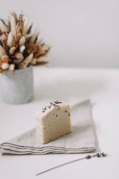 Handmade natural soap bars on white background. Soap making. copyspace, flat lay, top view - 写真・画像