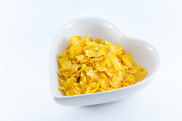 eine Schüssel nahrhaftes und leckeres Cornflakes mit Milch - Foto, Bild