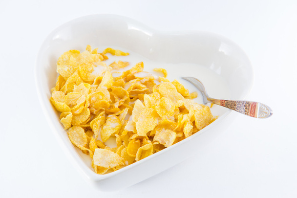 Uma tigela de cereal floco de milho nutritivo e delicioso com leite
 - Foto, Imagem
