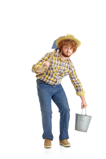 Handsome farmer, rancher isolated over white studio background - Фото, изображение