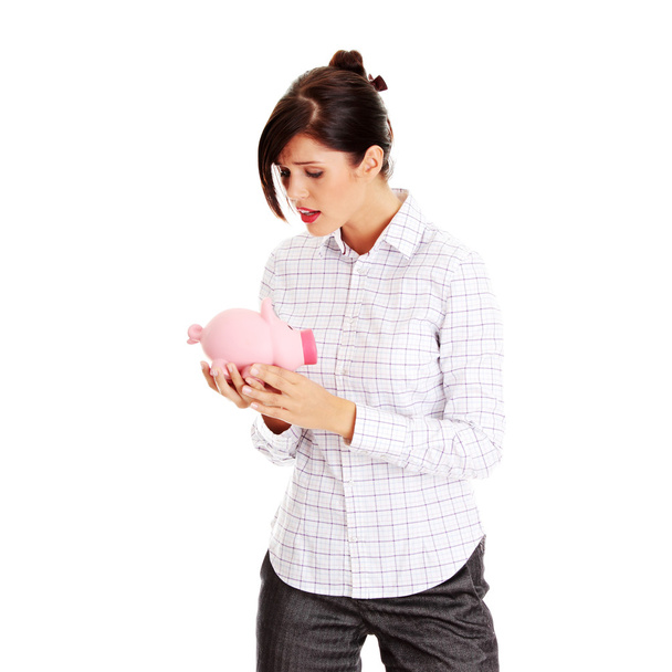Woman and piggy bank - Foto, immagini