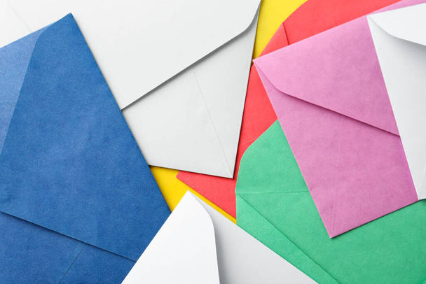 Colorful paper envelopes as background, top view - Photo, image