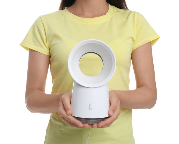 Woman with portable fan on white background, closeup. Summer heat - Fotografie, Obrázek