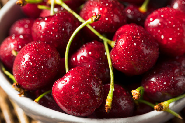 Raw Red Organic Cherries in a Bowl Ready to Eat - 写真・画像