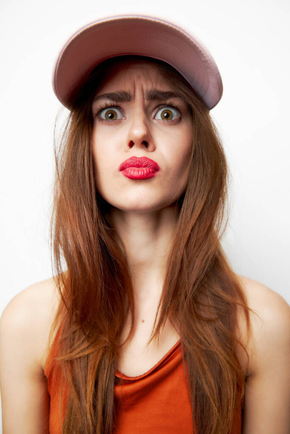 Woman with a cap Perplexed look charm model on her head sexy look  - Photo, Image