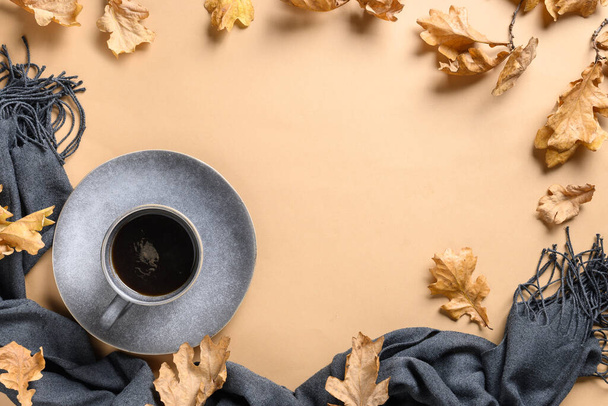 Coffee in grey cup and dry oak leaves. - Photo, Image