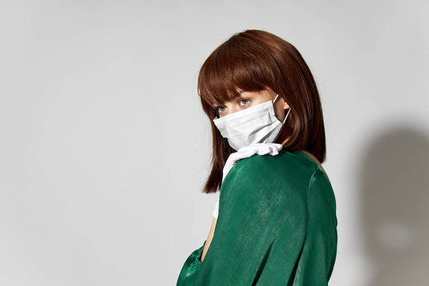  Fashion female coronavirus, model posing with gloves and protective medical mask - Фото, зображення