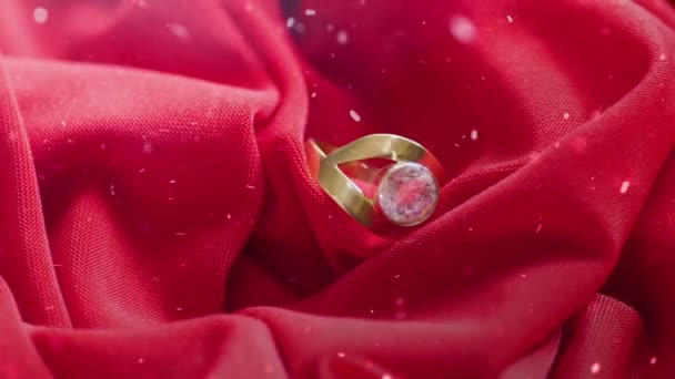 Snowing over diamond ring on satin - Footage, Video