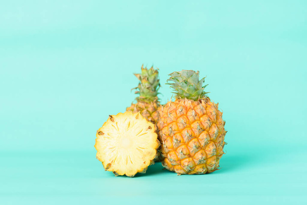 Fresh pineapple fruit on pastel green background, Tropical fruit - Фото, изображение