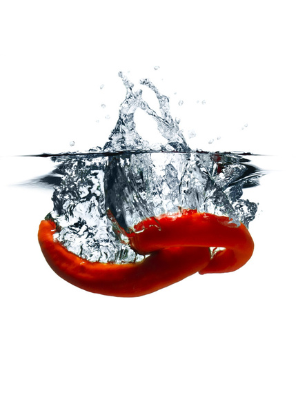 Red hot chili peppers dropped into water - Foto, immagini