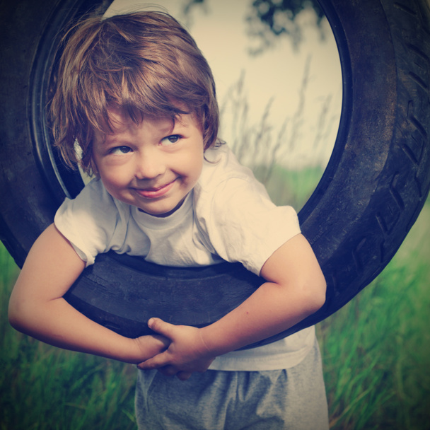 Happy boy on swing outdoors - Valokuva, kuva
