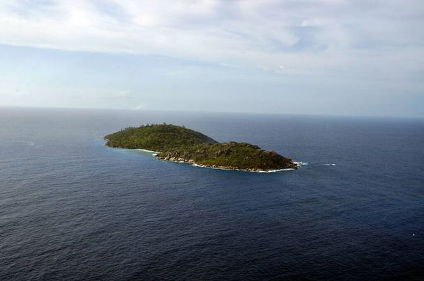 Aerial view of a tropical island with coastline and blue ocean. Flicit Island, La Digue, Seychelles - Photo, Image