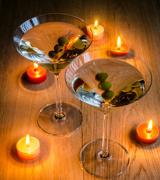 Two olive martini cocktails in the candlelight - Foto, imagen