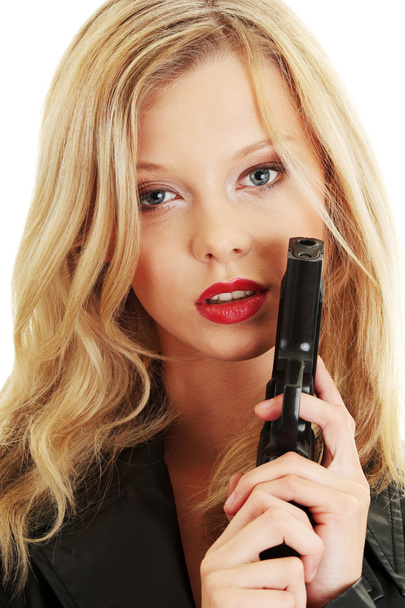 Sexy blond woman with handgun - Фото, изображение