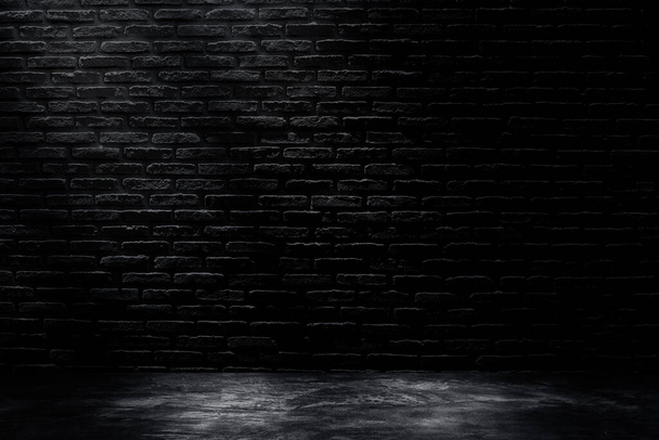Studio dark room with black brick wall with concrete floor and lighting effect. - Photo, Image