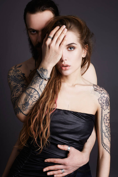 fashion beautiful couple together.Tattoo Hipster boy and girl - Foto, immagini