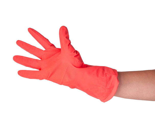 Roze rubber handschoen op vrouw hand geïsoleerd op de witte - Foto, afbeelding