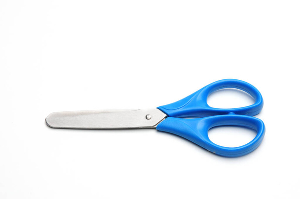 Blue baby scissors on an isolated white background/Blue baby scissors on an isolated white background - Photo, Image
