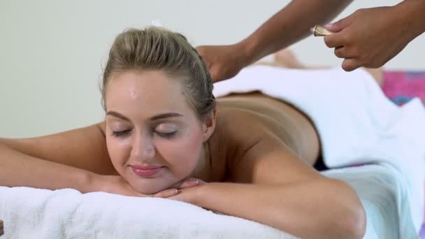 Woman gets back massage spa by massage therapist. - Footage, Video