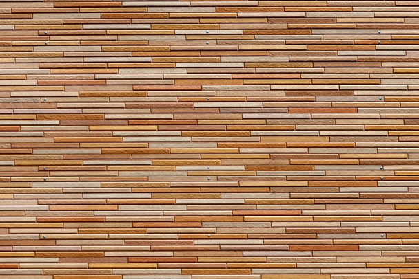 Plastic surface with imitation of brown stone masonry. Modern finishing material. Background image, texture - Zdjęcie, obraz