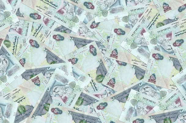 500 UAE dirhams bills lies in big pile. Rich life conceptual background. Big amount of money - Photo, Image