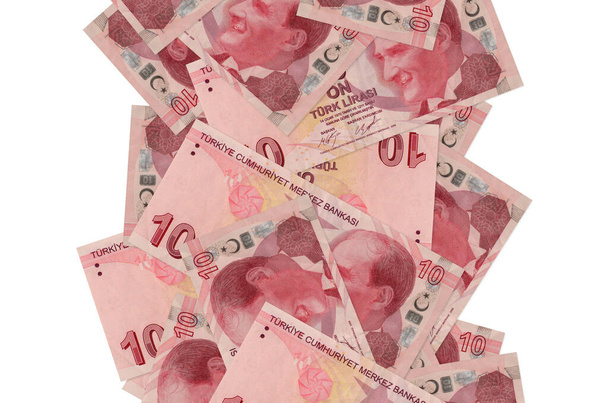 10 türkische Lira-Scheine flogen vereinzelt auf weiß herunter. Viele Banknoten mit weißem Kopierraum links und rechts - Foto, Bild
