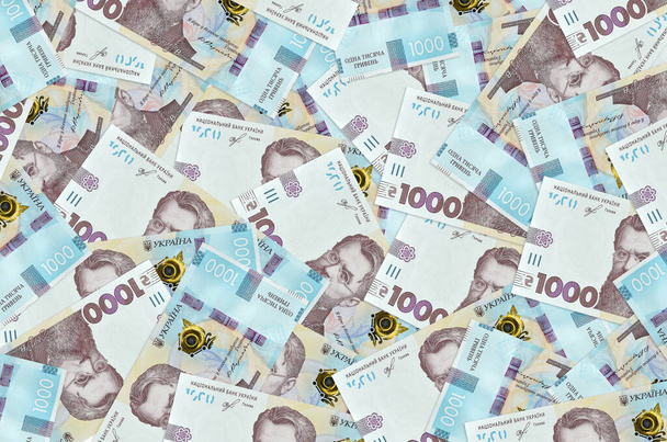 1000 ukrán hrivnya van nagy kupacban. Gazdag élet konceptuális háttér. Nagy mennyiségű pénz. - Fotó, kép