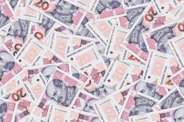 20 horvát kuna bankjegy van nagy kupacban. Gazdag élet konceptuális háttér. Nagy mennyiségű pénz. - Fotó, kép