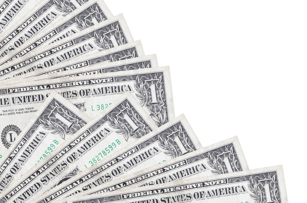 1 dólar estadounidense se encuentra aislado sobre fondo blanco con espacio de copia apilada en el ventilador de cerca. Concepto de día de pago u operaciones financieras - Foto, imagen