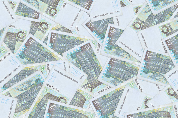 10 Croatian kuna bills lies in big pile. Rich life conceptual background. Big amount of money - Photo, Image