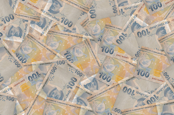 100 türkische Lira-Scheine liegen auf einem großen Haufen. Reicher Lebenshintergrund. Viel Geld - Foto, Bild