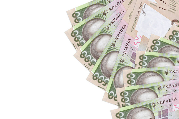 500 Ukrainian hryvnias bills lies isolated on white background with copy space. Rich life conceptual background. Big amount of national currency wealth - Photo, Image