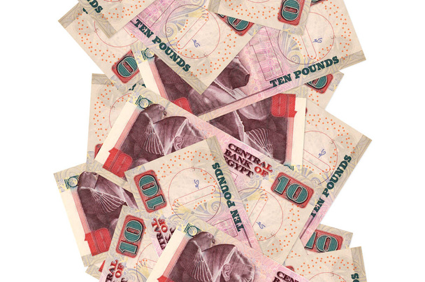 Beyazlar üzerinde izole edilmiş 10 Mısır sterlinli banknotlar. Birçok banknot sol ve sağ tarafta beyaz kopya alanı ile düşüyor - Fotoğraf, Görsel