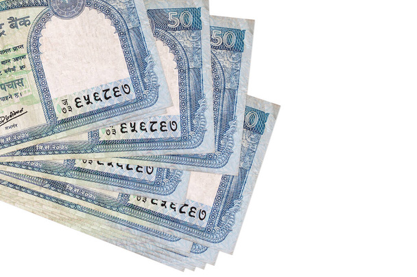 50 nepálských rupií bankovky leží v malém svazku nebo balení izolované na bílém. Mockup s kopírovacím prostorem. Obchodní a devizový koncept - Fotografie, Obrázek