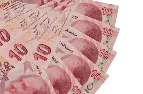 10 török líra bankjegyek elszigetelt fehér háttér másolási hely halmozott ventilátor alakban közeli. Pénzügyi tranzakciók fogalma - Fotó, kép
