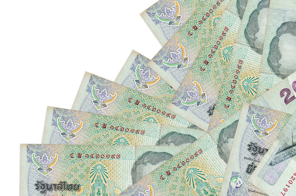 20 tajskich banknotów Bahta leży w innej kolejności na białym. Lokalna bankowość lub koncepcja produkcji pieniędzy. Baner informacyjny - Zdjęcie, obraz