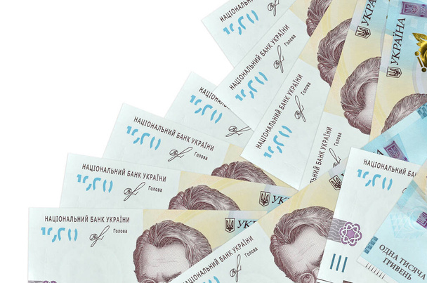 1000 ukrán hrivnya bankjegyek fekszik különböző sorrendben elszigetelt fehér. Helyi banki vagy pénzkereseti koncepció. Üzleti háttér banner - Fotó, kép