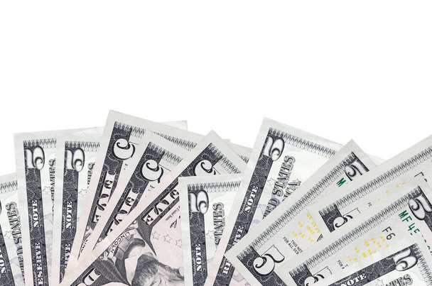 5 Amerikan doları banknotlar ekranın alt tarafında, beyaz arka planda, fotokopi alanı ile izole bir şekilde duruyor. Paralı iş kavramları için arkaplan afişi şablonu - Fotoğraf, Görsel